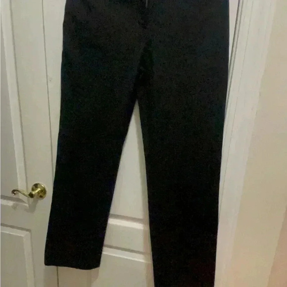 St. John black jeans in new condition . Gorgeous hardware around the belts . - Picture 12 of 14